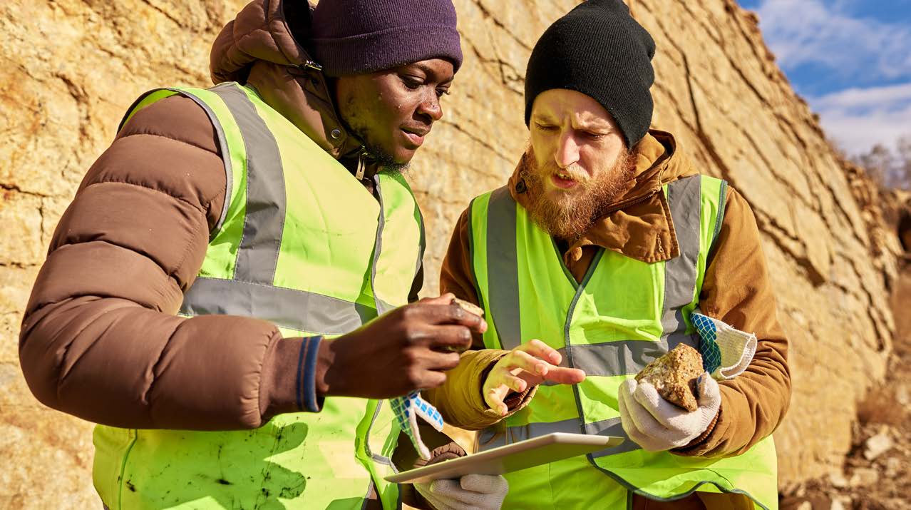 Construction Workers looking at Equipment Share Tracking Software