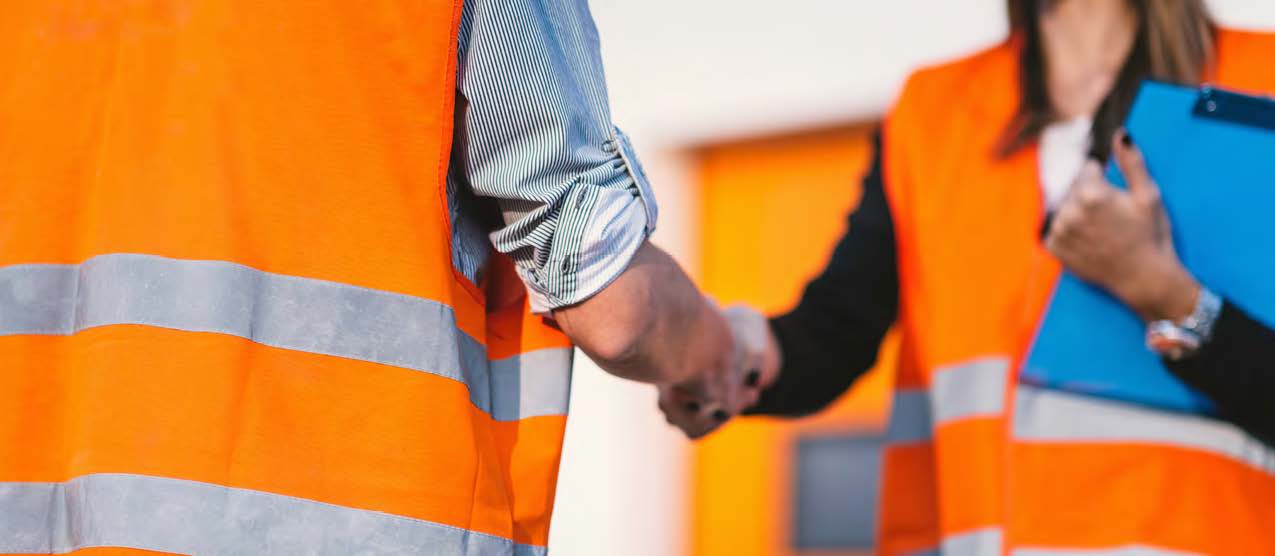 Workers discussing Equipment Share Tracking Solutions