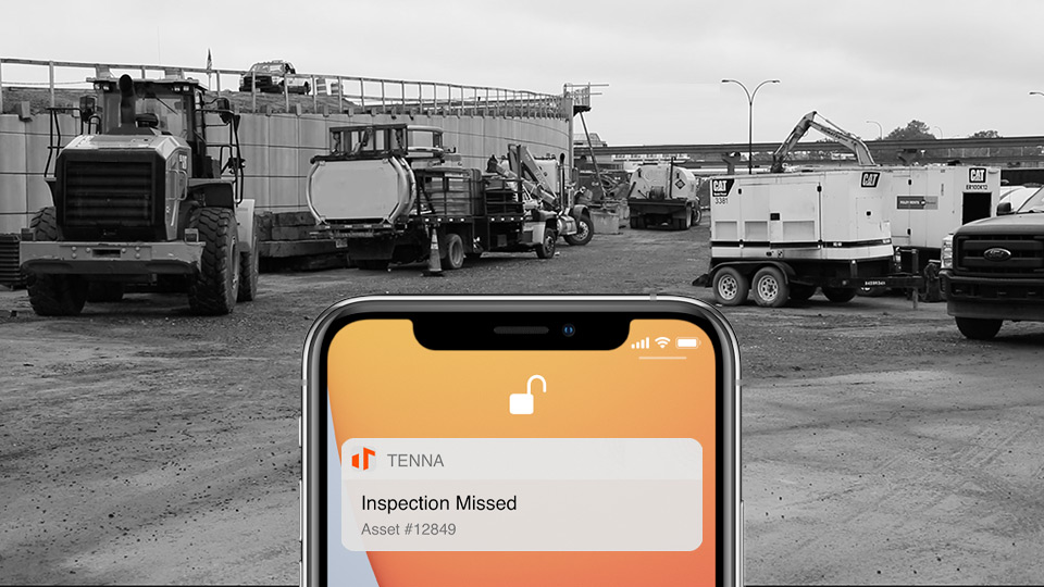 Mockup of a Tenna App Missed Equipment Inspections notification with a black and white image of a construction site in the background