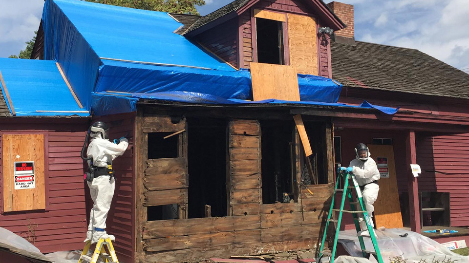 Air American Integrity employees working on a residential site