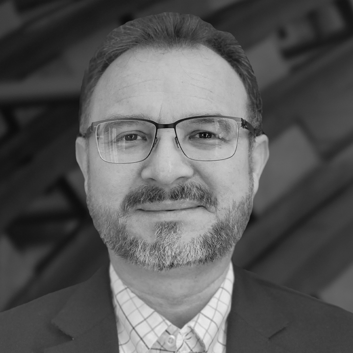 Enrique Alfaro headshot in black and white