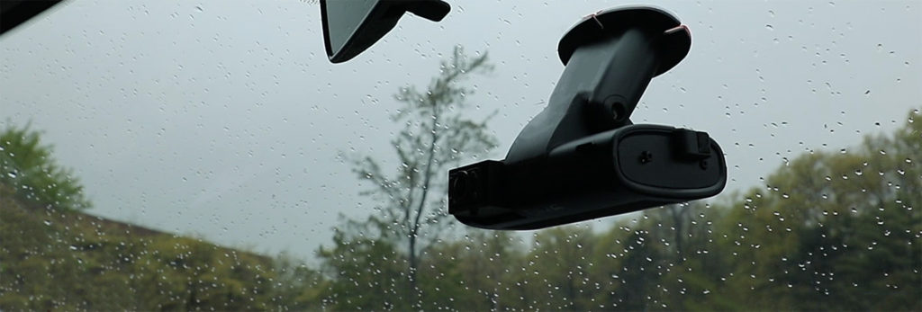 Side view of the fleet dashcam TennaCAM 2.0 on a windshield Side view of the fleet dashcam TennaCAM 2.0 on a windshield